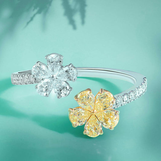 Diamantring mit einer Blume aus weißen Diamanten und eine Blume mit gelben Diamanten