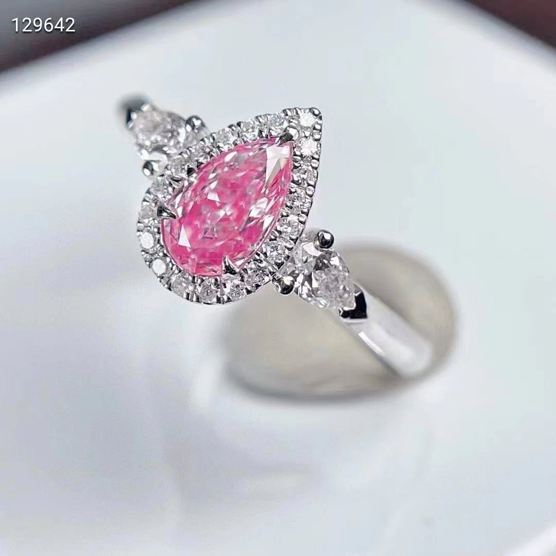 Lumière de Rose: 0.55 carat teardrop classic three-stone pink diamond ring in white gold