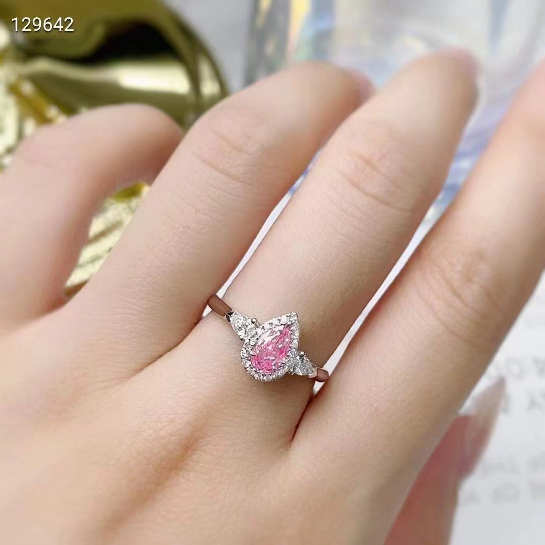 Lumière de Rose: 0.55 carat teardrop classic three-stone pink diamond ring in white gold