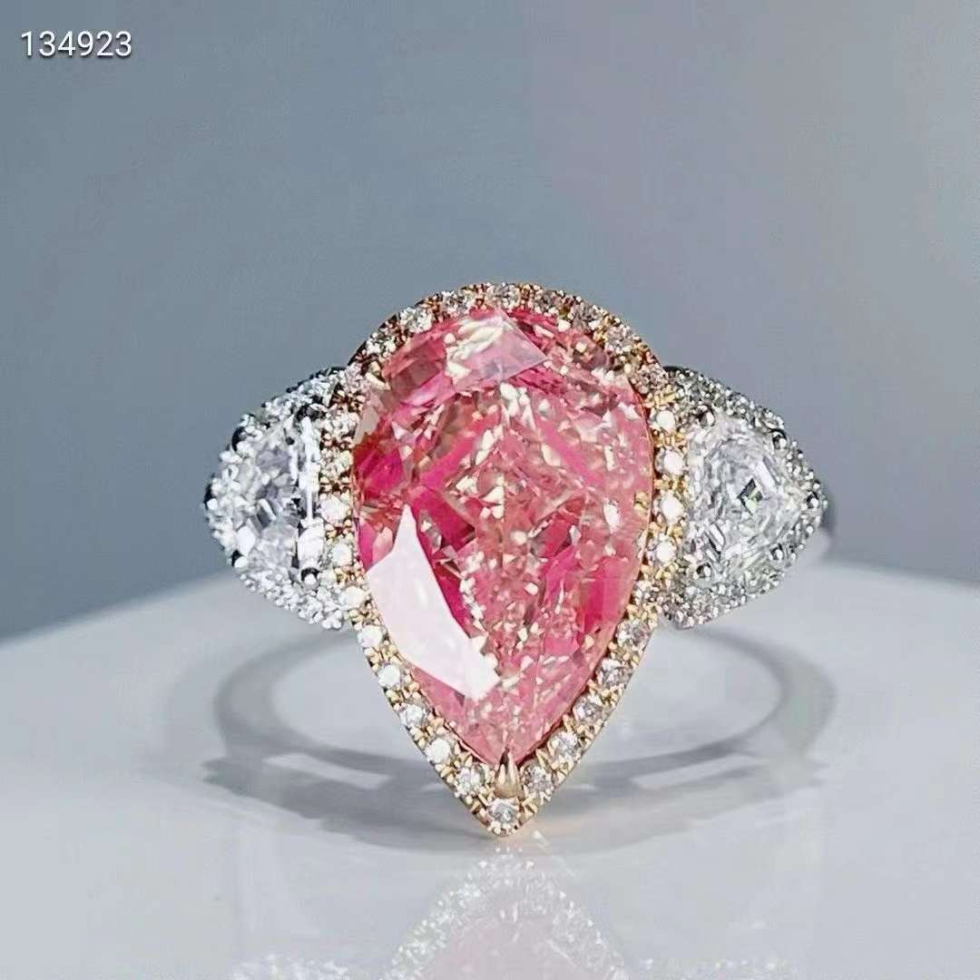 Elegance in pink: The 18k gold 5ct VVS pear cut pink moissanite diamond ring