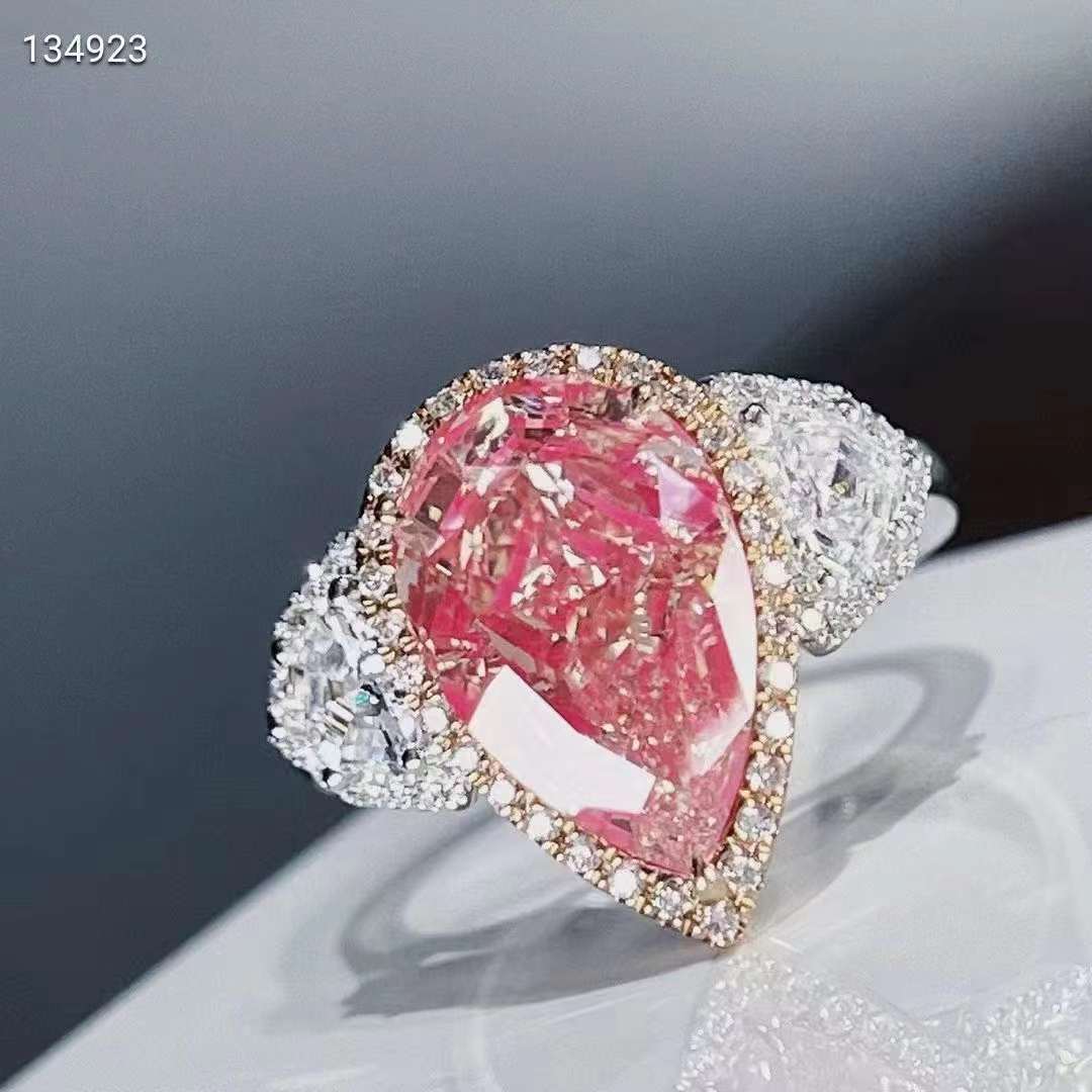 Elegance in pink: The 18k gold 5ct VVS pear cut pink moissanite diamond ring