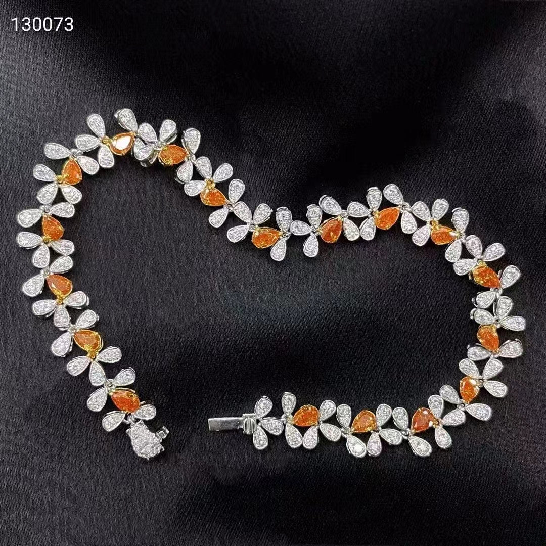 A gem of elegance: 18k white gold bracelet with orange diamonds