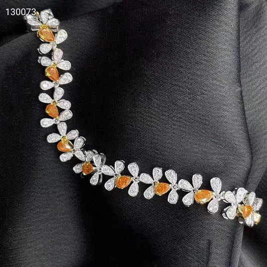 A gem of elegance: 18k white gold bracelet with orange diamonds