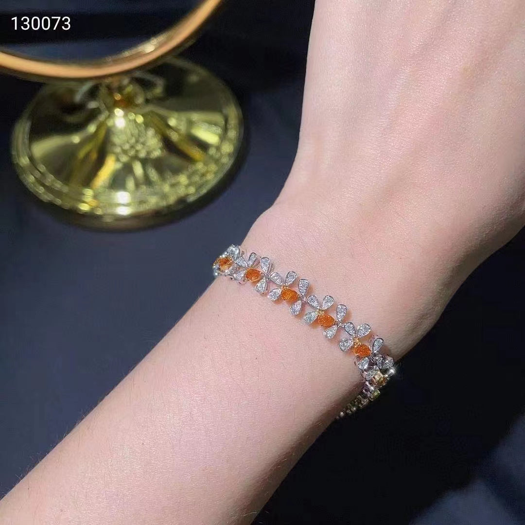 A gem of elegance: 18k white gold bracelet with orange diamonds